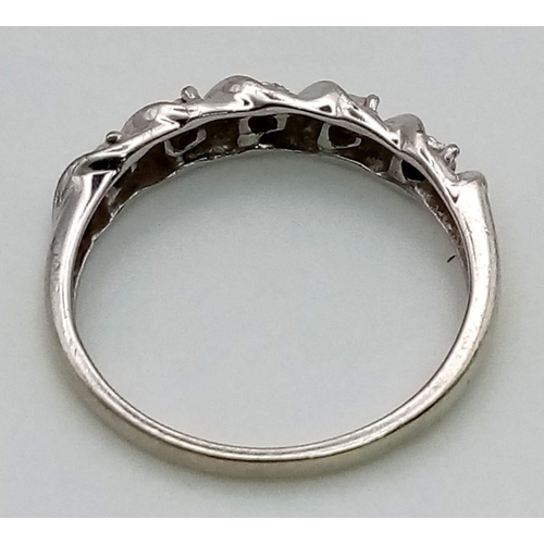 208 - A 9K White Gold Diamond Half-Eternity Ring. Five small round-cut diamonds. Size N. 2.25g.