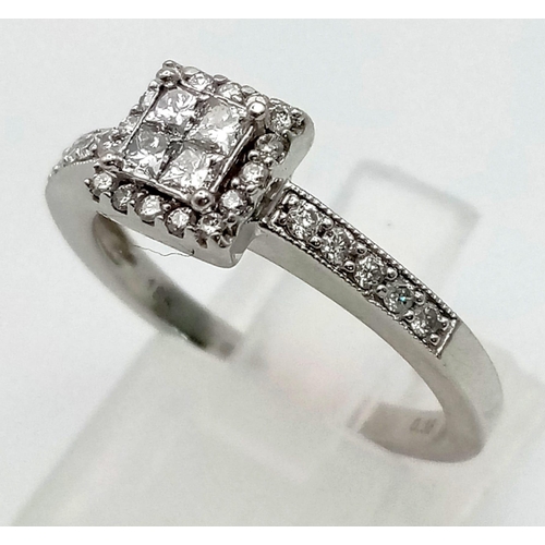 297 - An 18 K white gold diamond cluster ring. Diamonds 0.38 carats, Ring size: n, total weight: 3.7 g.