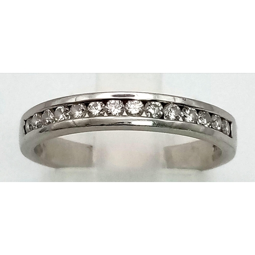 380 - A 950 Platinum Diamond Half Eternity Ring. 15 small diamonds. Size L. 3.7g total weight. Ref: 0059