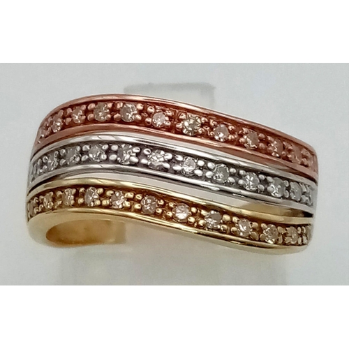 465 - A 9 K three colour gold ring with diamond bands. Diamonds 0.35 carats. Ring size: L, weight: 2.7 g.