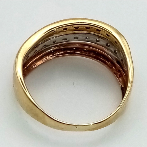 465 - A 9 K three colour gold ring with diamond bands. Diamonds 0.35 carats. Ring size: L, weight: 2.7 g.