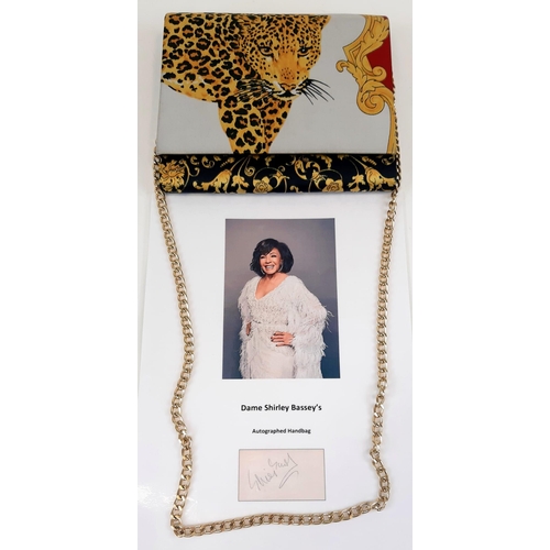 136 - A Dame Shirley Bassey Autographed Handbag. A Leopard decorated satin mirror flap bag. Confirmed sign... 