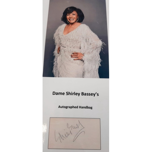 136 - A Dame Shirley Bassey Autographed Handbag. A Leopard decorated satin mirror flap bag. Confirmed sign... 