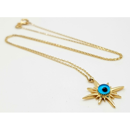 341 - A 14 K yellow gold evil eye pendant on chain (41 cm long) weight: 2.2 g.