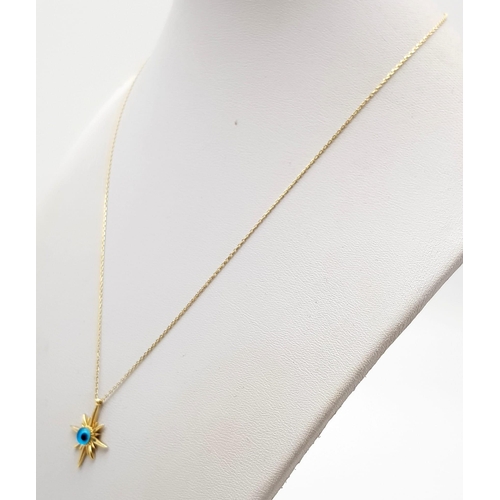 341 - A 14 K yellow gold evil eye pendant on chain (41 cm long) weight: 2.2 g.