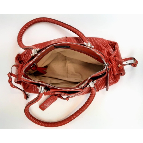 436 - A Chloe Red Shoulder Bag. Red calf leather with silver tone hardware. Two exterior flap pockets with... 