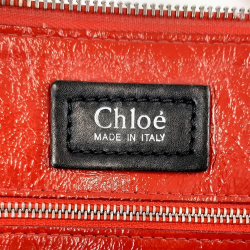 436 - A Chloe Red Shoulder Bag. Red calf leather with silver tone hardware. Two exterior flap pockets with... 