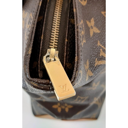 248 - A Louis Vuitton Cabas Piano in Brown Coated Canvas Bag. Leather strap. Cloth interior with zip pocke... 