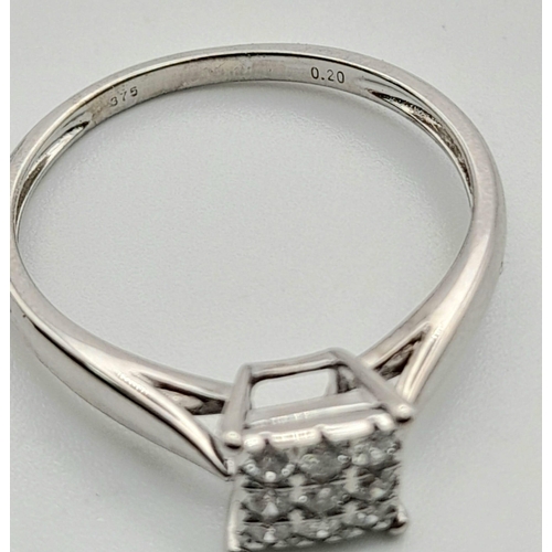 332 - An 9 K white gold diamond (0.20 carats) cluster ring. Size: P, weight: 2 g.