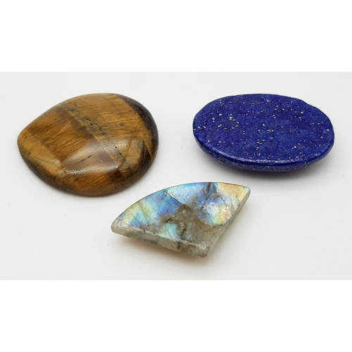 411 - Lot of 3 Gemstones - 37.89 Ct Cabochon Lapis Lazuli, 47.51 Ct Cabochon Tiger Eye & 19.24 Ct Cabochon... 