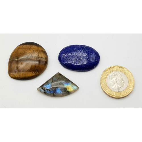 411 - Lot of 3 Gemstones - 37.89 Ct Cabochon Lapis Lazuli, 47.51 Ct Cabochon Tiger Eye & 19.24 Ct Cabochon... 