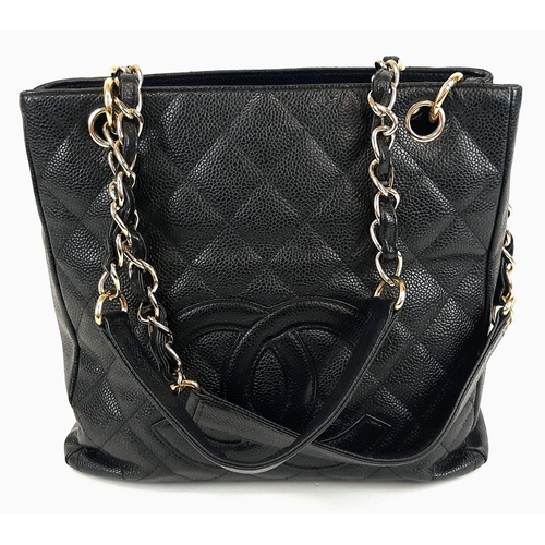 52 - A Chanel Petite Black Leather Shopping Tote Bag. Gilded and leather strap. Flap and zip pocket inter... 