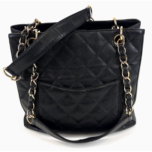 52 - A Chanel Petite Black Leather Shopping Tote Bag. Gilded and leather strap. Flap and zip pocket inter... 