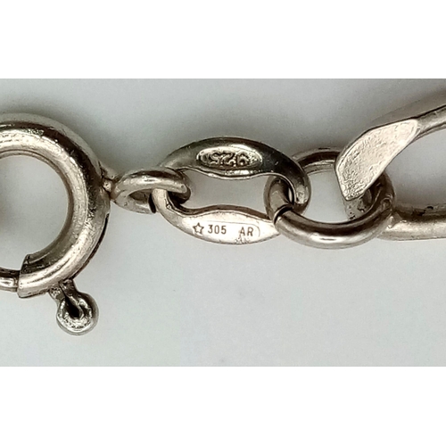 608 - A sterling silver bracelet with eleven charms. Weight: 28.7 g.