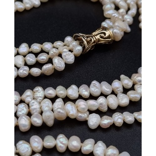 5 - 3 ROWS OF NATURAL SOUTH SEA PEARLS WITH TWO 14K GOLD CATCHES , TRANSFORMS INTO A 6 ROW CHOKER