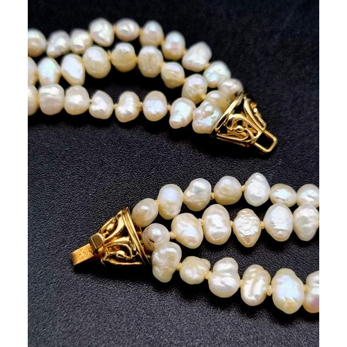 5 - 3 ROWS OF NATURAL SOUTH SEA PEARLS WITH TWO 14K GOLD CATCHES , TRANSFORMS INTO A 6 ROW CHOKER