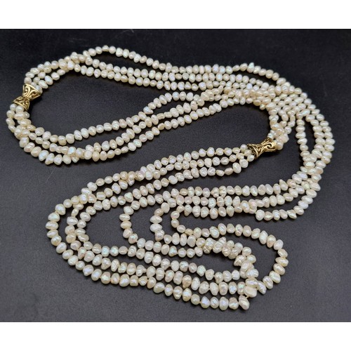 5 - 3 ROWS OF NATURAL SOUTH SEA PEARLS WITH TWO 14K GOLD CATCHES , TRANSFORMS INTO A 6 ROW CHOKER