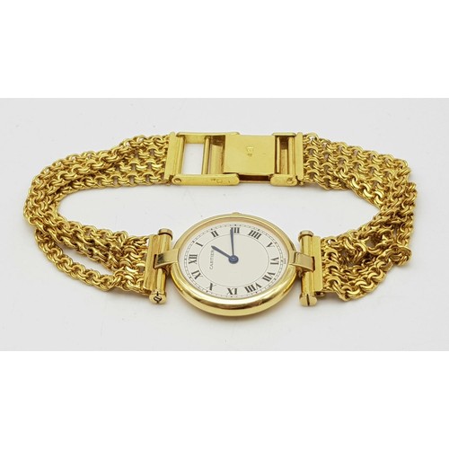 64 - A LADIES 18K GOLD CARTIER WRISTWATCH ON CHAIN STYLE STRAP , ROUND FACE WITH ROMAN NUMERALS.  24mm