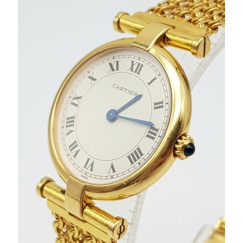 64 - A LADIES 18K GOLD CARTIER WRISTWATCH ON CHAIN STYLE STRAP , ROUND FACE WITH ROMAN NUMERALS.  24mm