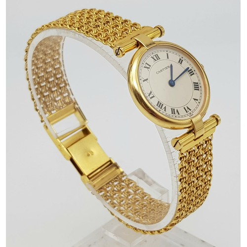 64 - A LADIES 18K GOLD CARTIER WRISTWATCH ON CHAIN STYLE STRAP , ROUND FACE WITH ROMAN NUMERALS.  24mm