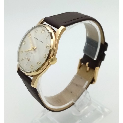 38 - A Vintage 9K Yellow Gold Ollivant and Botsford Gents Watch. Brown leather strap. 9K gold case - 34mm... 