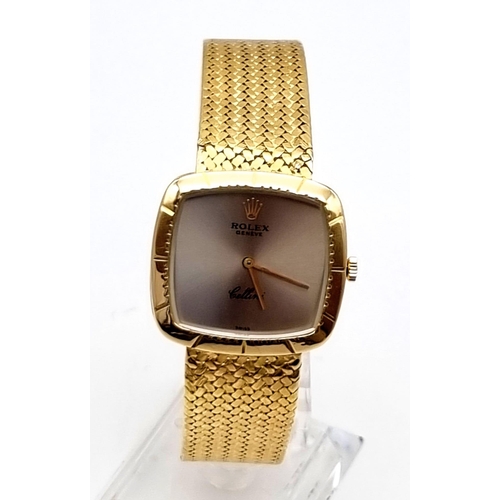 100 - A gents ROLEX CELLINI, solid 18 K yellow gold watch and strap, Case width 30 mm  with smoked grey di... 