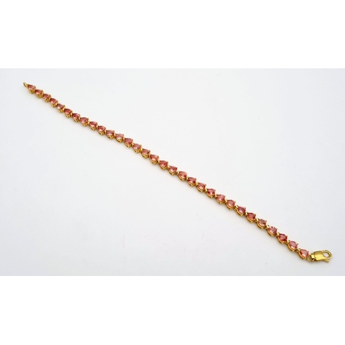 102 - An 18K Yellow Gold Pink Topaz Tennis Bracelet. 31 beautiful clean topaz teardrops create a stunning ... 