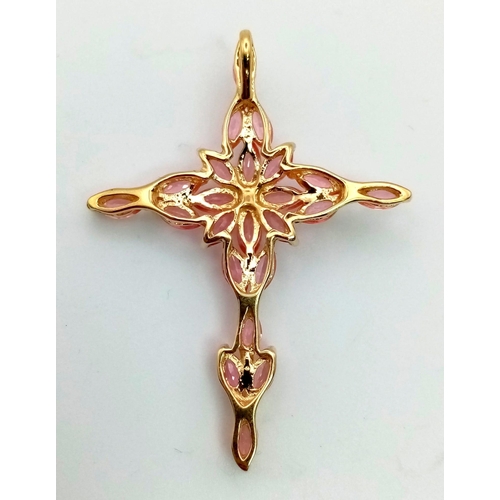 136 - An 18K Yellow Gold Pink Topaz Cross Pendant. 21 clean, pink, oval cut topaz set gemstones give this ... 