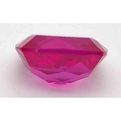 154 - A wonderful, large (50.15 carats), pinkish red Ruby. Cushion cut, flawless, with uniform colouration... 