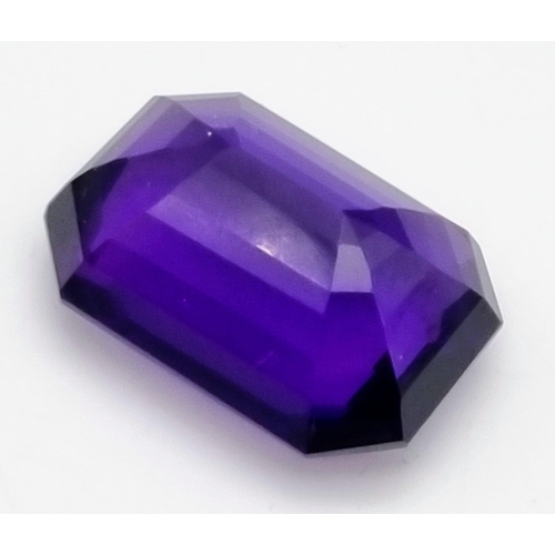 175 - A very collectable, large (76.80 carats) amethyst. Emerald cut with a strong violet colour saturatio... 