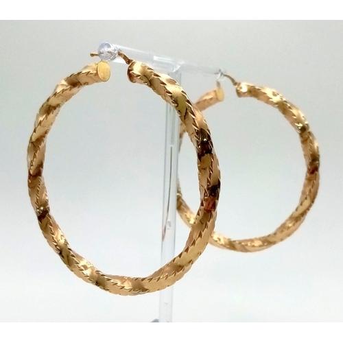 20 - Two 9K Yellow Gold Large Twist Creole Earrings. 6cm inner diameter. 7.1g total weight.