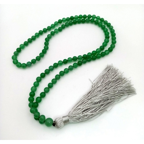 203 - A genuine Mala Buddhist praying bracelet. 108 pale green, high quality, jade beads. Weight: 38g.