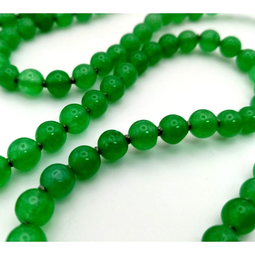 203 - A genuine Mala Buddhist praying bracelet. 108 pale green, high quality, jade beads. Weight: 38g.