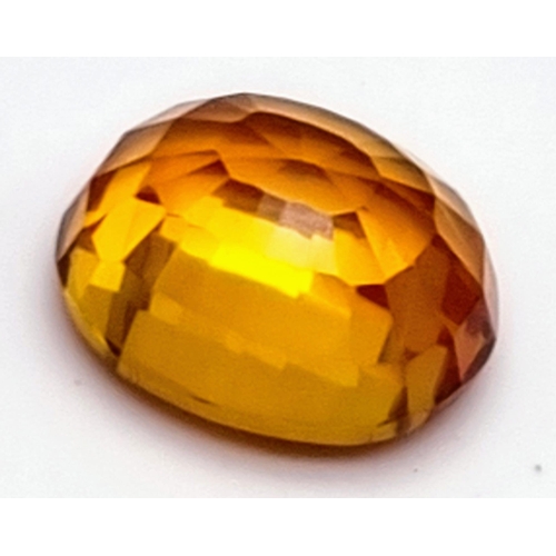 217 - A very desirable, large (25.80 carats) orange sapphire. Cushion cut, flawless, with wonderful colour... 