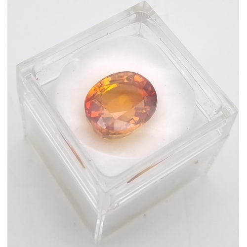 217 - A very desirable, large (25.80 carats) orange sapphire. Cushion cut, flawless, with wonderful colour... 