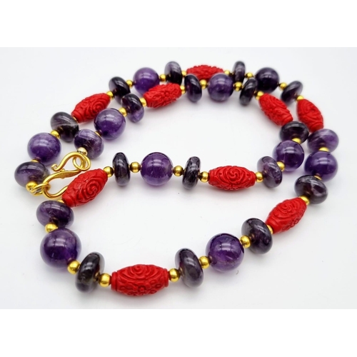 224 - A yellow metal (untested) glamorous, natural amethyst and Chinese cinnabar necklace and earrings set... 