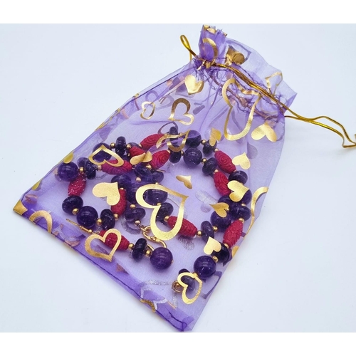 224 - A yellow metal (untested) glamorous, natural amethyst and Chinese cinnabar necklace and earrings set... 