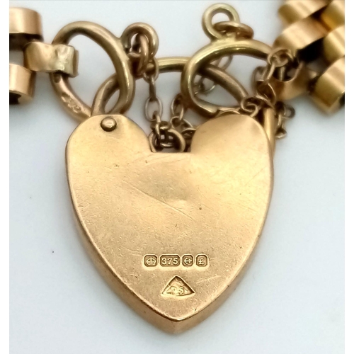 58 - A Vintage 9K Yellow Gold Fancy Gate Brick Design Bracelet. Heart padlock and safety chain. 20cm. 27.... 