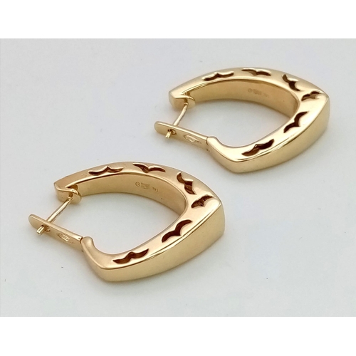 9 - A Stylish Pair of Continental 14k Yellow Gold Mother of Pearl Hoop Earrings. 12.51g total weight.