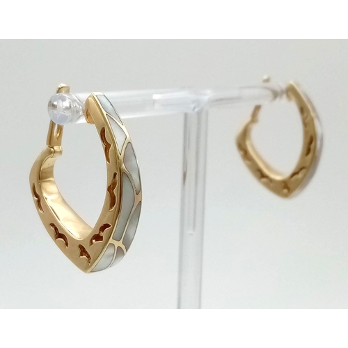 9 - A Stylish Pair of Continental 14k Yellow Gold Mother of Pearl Hoop Earrings. 12.51g total weight.