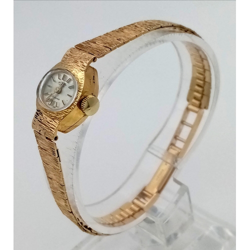 104 - A 9k Gold Vintage Rotary Ladies Watch. 9k Gold strap and case - 15mm. Tree-Bark effect on strap. Mec... 