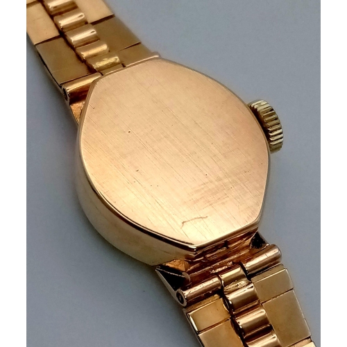 104 - A 9k Gold Vintage Rotary Ladies Watch. 9k Gold strap and case - 15mm. Tree-Bark effect on strap. Mec... 