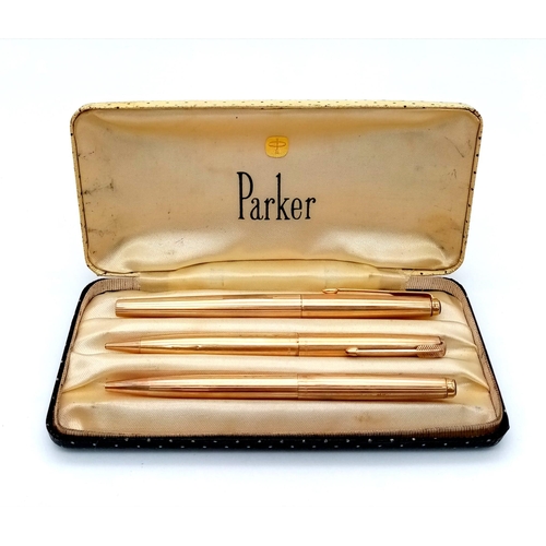 115 - A Vintage Set of Three Gilded Parker Pens: Ballpoint, Fountain and Pencil. Comes in original Parker ... 