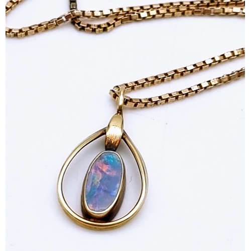 165 - An Antique Natural Oval Cabochon Fire Opal Pendant set in 9K Gold with a 9K Gold Necklace. 20mm and ... 