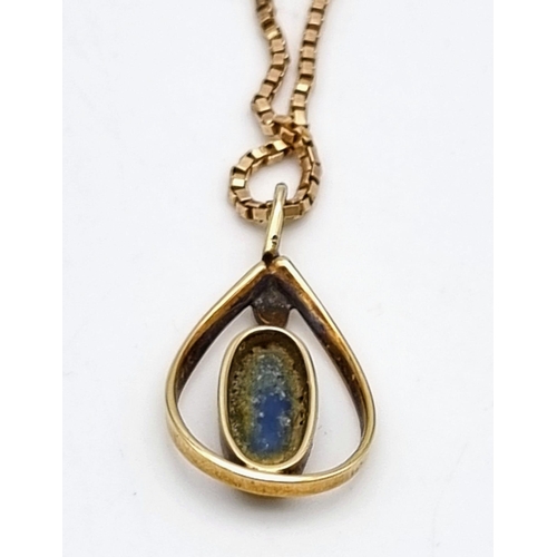 165 - An Antique Natural Oval Cabochon Fire Opal Pendant set in 9K Gold with a 9K Gold Necklace. 20mm and ... 