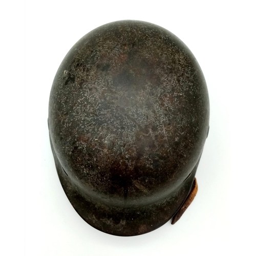 121 - A German WW2 M-40 Luftwaffe Helmet. Single decal still present. Chinstrap named and dated for 1942. ... 