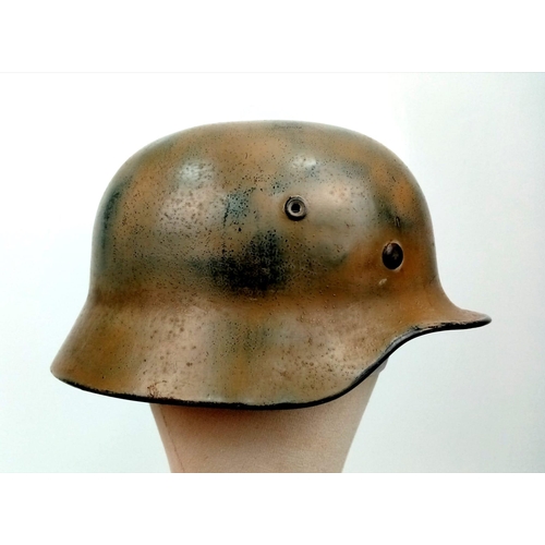 145 - A WW2 German Luftwaffe Helmet with Single Decal. Painted in tropical/Italian paint. Markings on chin... 