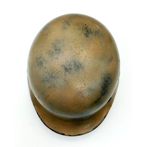 145 - A WW2 German Luftwaffe Helmet with Single Decal. Painted in tropical/Italian paint. Markings on chin... 