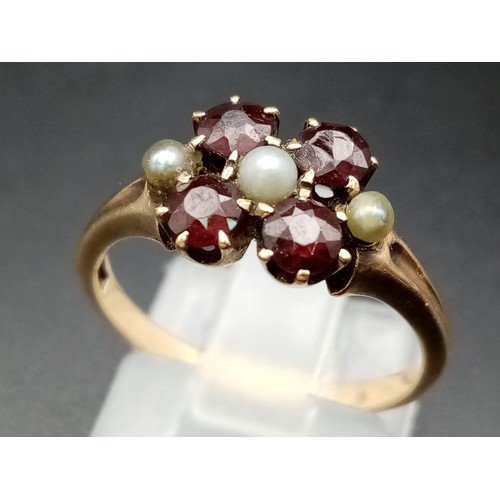 736 - A vintage 14 K yellow gold ring with garnets and seed pearls. Size: L, weight: 2.8 g.