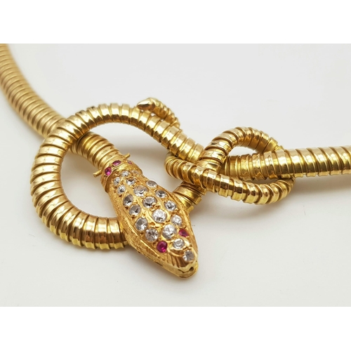 148 - A Hypnotising 18K Yellow Gold and Ruby Snake Collarette Necklace. A beautiful swirling snake-like de... 